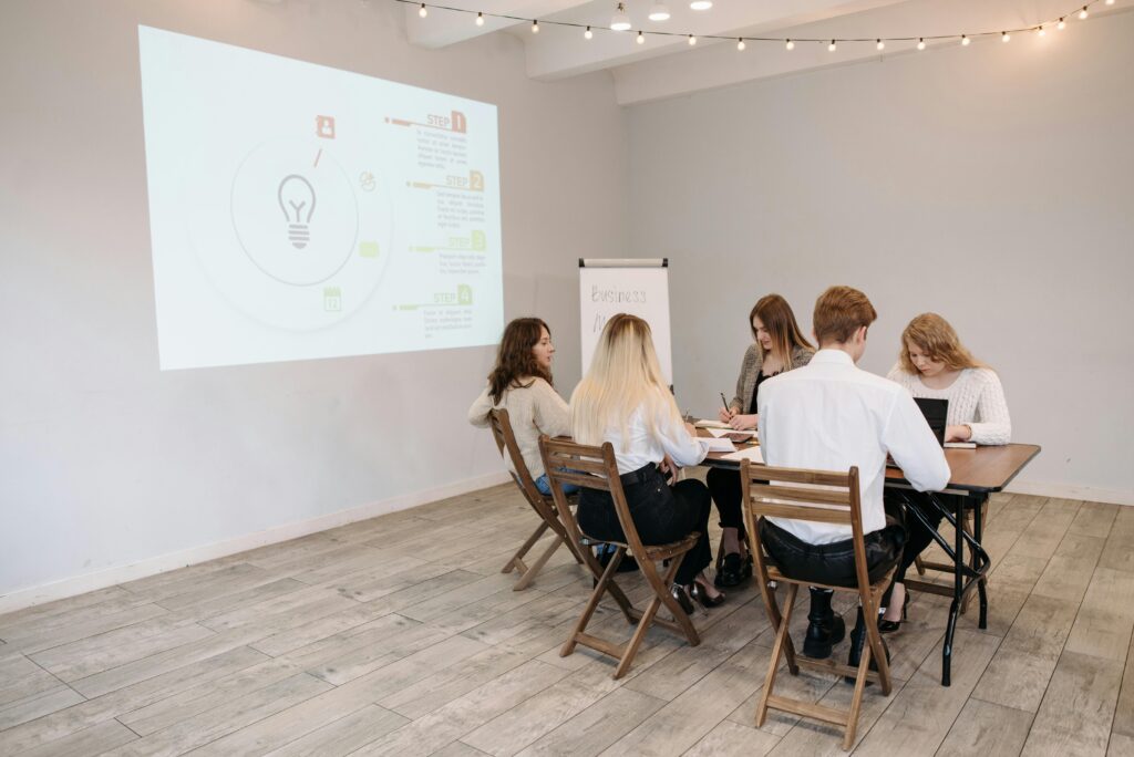 Group of young professionals collaborating in a bright office setting.